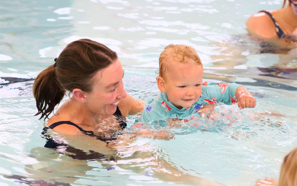 Woman and baby in the pool